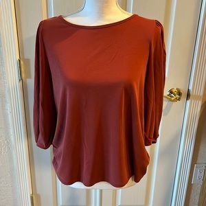 Green envelope rust colored top